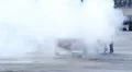 Man extinguishing car fire after crash, accident, thick smoke HD Footage