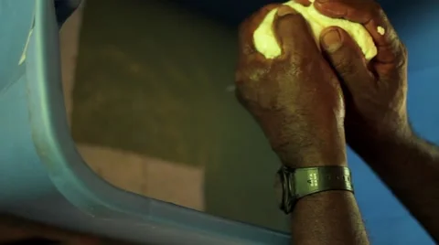 Man extracting water from tofu Stock Footage 48743236