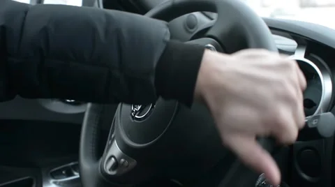 A man extreme drives Nissan, turn the steering wheel and use the Hand brake Stock Footage 59440138