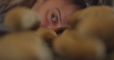 Man eye looking at potatoes on table rack focus Stock Footage 249299936
