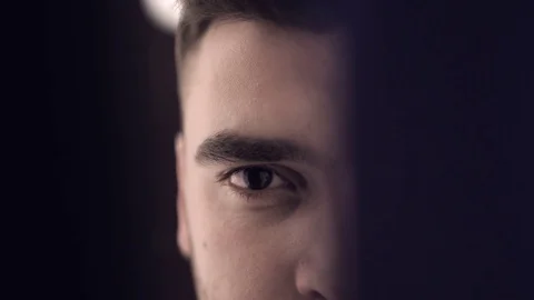 Man eye watching through door slot. 4K Video stock 71326426