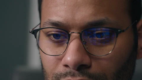 Man in eyeglasses in front of laptop coding data finance bitcoin crypto currency Stock Footage 259067252