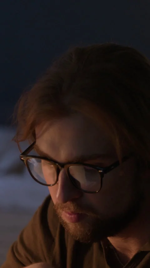 Man in Eyeglasses Working Late on Computer Screen at Home Stock Footage 345519724