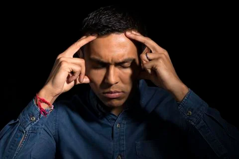 Man with Eyes Closed Touching Head as if Stressed Stock Photos