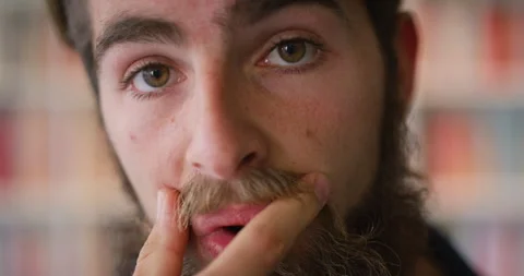 Man, face and confidence with moustache in library for higher education, Stock Footage 336643973