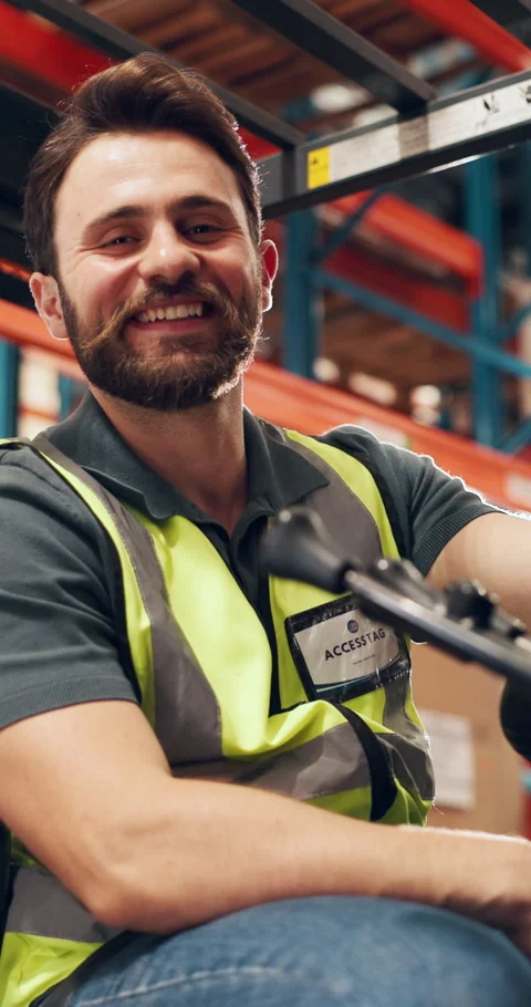 Man, face and forklift at warehouse for logistics with smile, pride or inventory Stock Footage 328231276