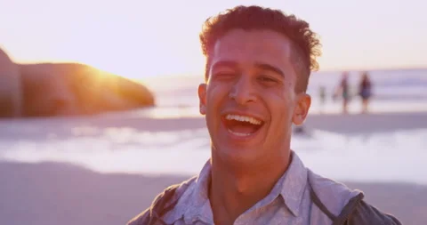 Man, face and laughing at beach for suns... | Stock Video | Pond5