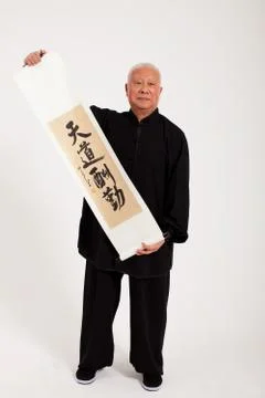 A man Face the camera. Text Shed shot Calligraphy and painting Oriental figures Stock Photos