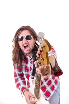 Man with face expression pointed his  guitar at the camera Stock Photos