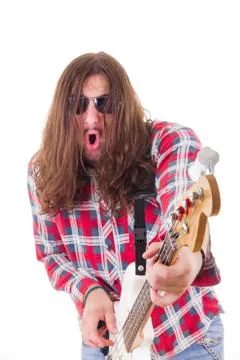Man with face expression in shirt playing electric bass guitar Stock Photos