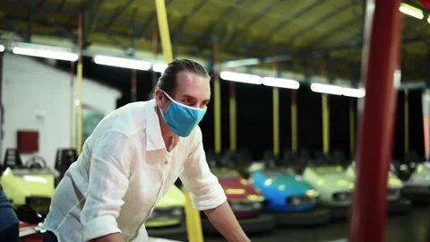 Man with face mask playing air hockey. Stock Footage 137675612