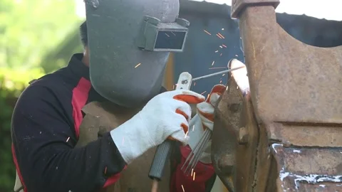 The man in the face mask is welded by argon welding. Stock Footage 194478997