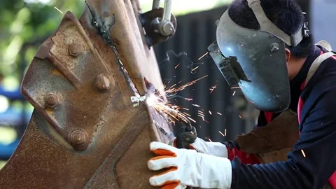 The man in the face mask is welded by argon welding. Stock Footage 194479071