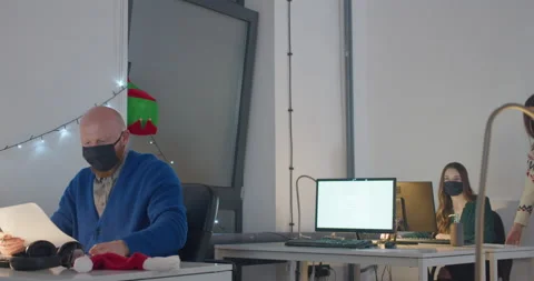 Man in face mask working in office at night Video stock 144271722