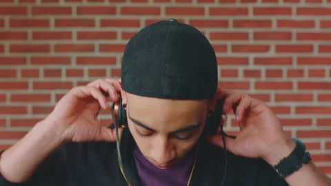 Man, face or student with headphones for music, audio streaming or development Stock Footage 334759549