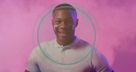 Man with face paint and circular animation design on pink background Stock Footage 305715964
