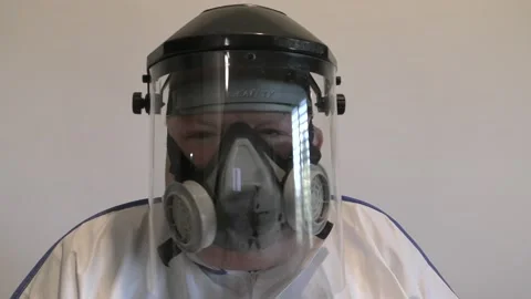 A man with face shield and mask protected from Coronavirus talking Видео 141224339