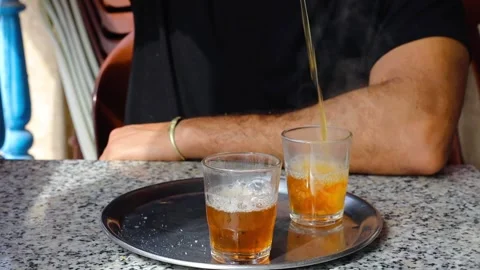 Man face unrecognizable preparing a traditional mint Morrocan tea close up view Stock Footage 334632122