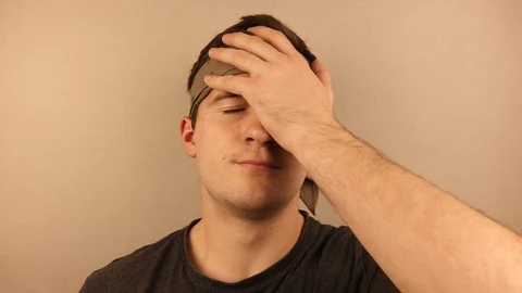 Man facepalm on a plain beige background Vídeo Stock 118836569