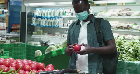 Man in facial mask buy basic necessities Video stock 160732316