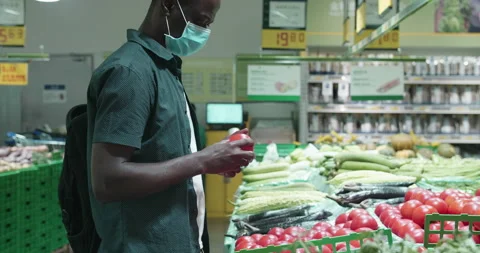 Man in facial mask buy basic necessities Video stock 160733416