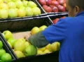 Man Facing Apples In Produce 02 Footage