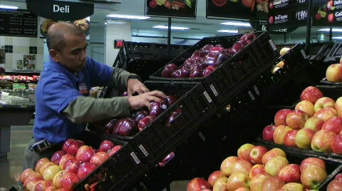 Man Facing Apples In Produce Stock Footage 112403