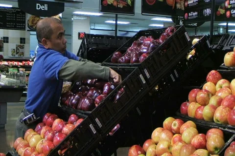 Man Facing Apples In Produce 動画素材 2738484