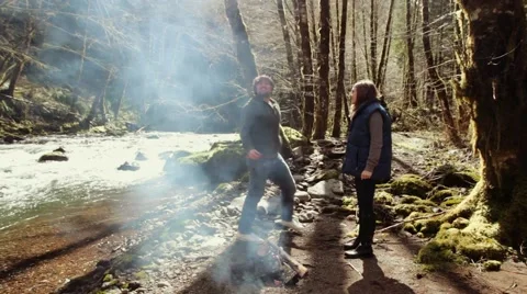 Man Fake Proposing in front of a fire Stock Footage 52330694