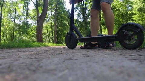 Man fall when riding an electric scooter. Riding an e-scooter without protective Video stock 247360238