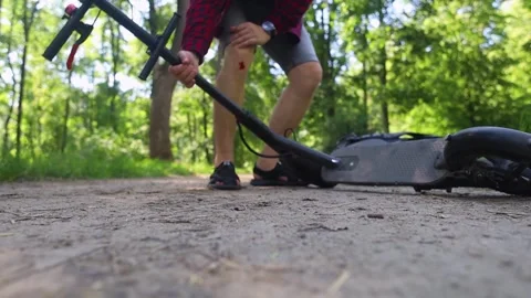 Man fall when riding an electric scooter. Riding an e-scooter without protective Video stock 247360268
