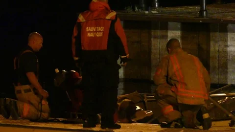 Man falling in boat while first responders are trying to help Stock Footage 82917454