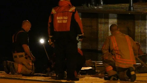 Man falling in boat while first responders are trying to help - 24fps mov Stock Footage 91906673