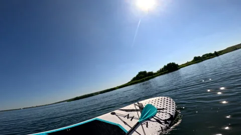 Man falling down out of balance board Stock Footage 255370810