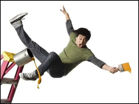 Man falling from ladder with paint brush Stock Photos