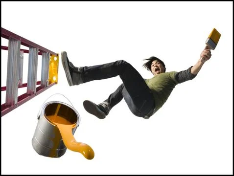 Man falling from ladder with paint brush Stock Photos