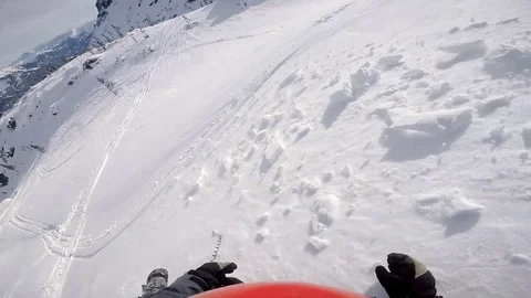 Man falling from a snowmobile in the mountains. Gopro. First person view. Slow Stock Footage 73160757