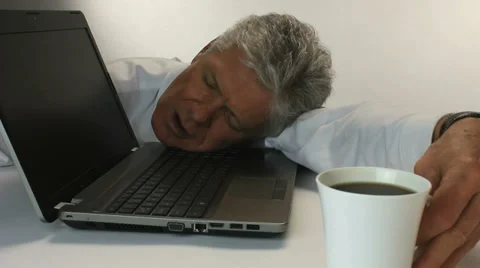 MAN FALLS ASLEEP AT WORK Stock Footage 35349776