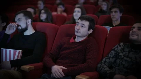 Man falls  aspeep at cinema 스톡 동영상 62114790