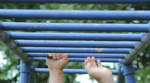 Man falls from bars - weak hands  Stock Footage 12057883