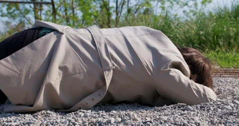 Man falls flat on ground Accident, driver flew out window insurance, seat belt Video stock 246649220