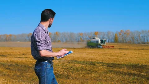 A man is a farmer working in the field. Stock Footage 97328767