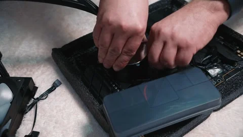 Man fastens water block to the computer motherboard Stock Footage 324594529