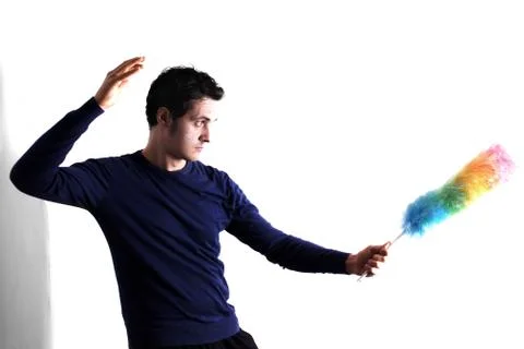 Man with feather duster Stock Photos