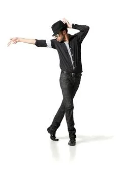 Man in fedora dancing in studio Foto stock