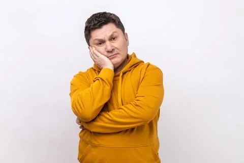 Man feeling bored with tedious conversation, looking at camera with disinterest Foto stock