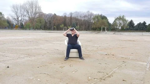 Man feeling cold is amazed by virtual world while wearing VR glasses Stock Footage 71483377