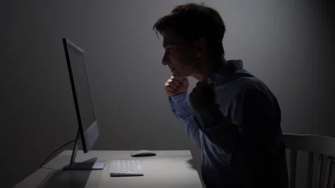 Man feeling excited and achieving success while working on a computer screen in Stock Footage 342673039