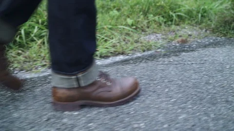 Man feeling freedom walking in forest near lake in rainy day. Stock Footage 101570623