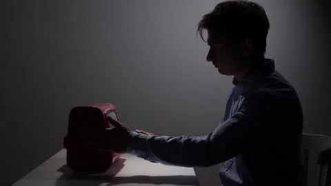 Man feeling frustration and anger, hitting a malfunctioning retro television Stock Footage 342672238